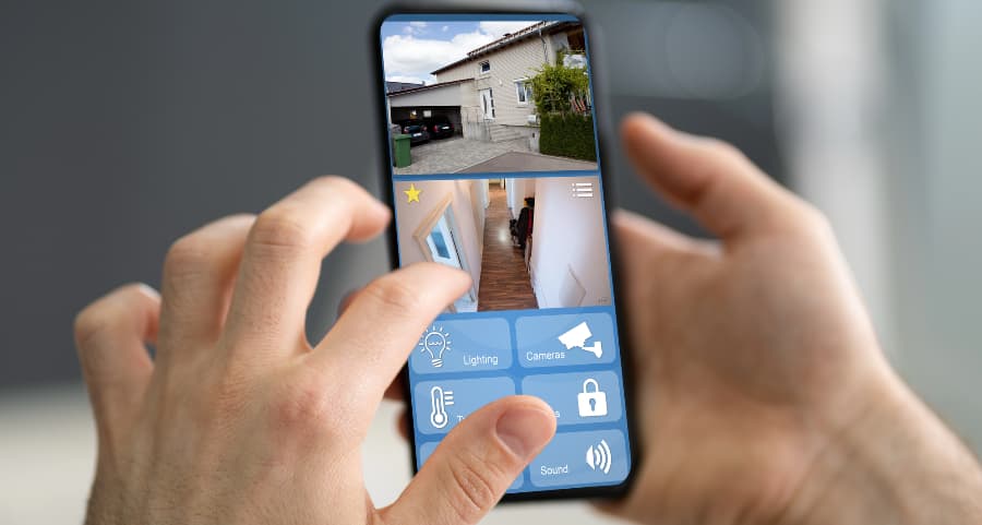 Person examining surveillance camera streams on a smartphone