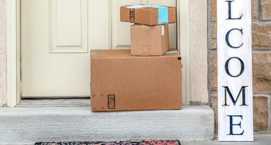 Deliveries on the front porch of a house with a welcome sign in Cedar Rapids